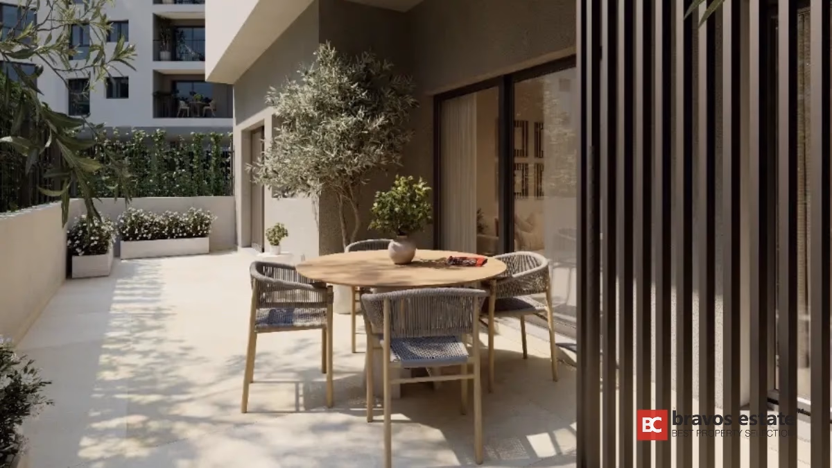Modern apartment terrace with dining furniture and plants in Alicante