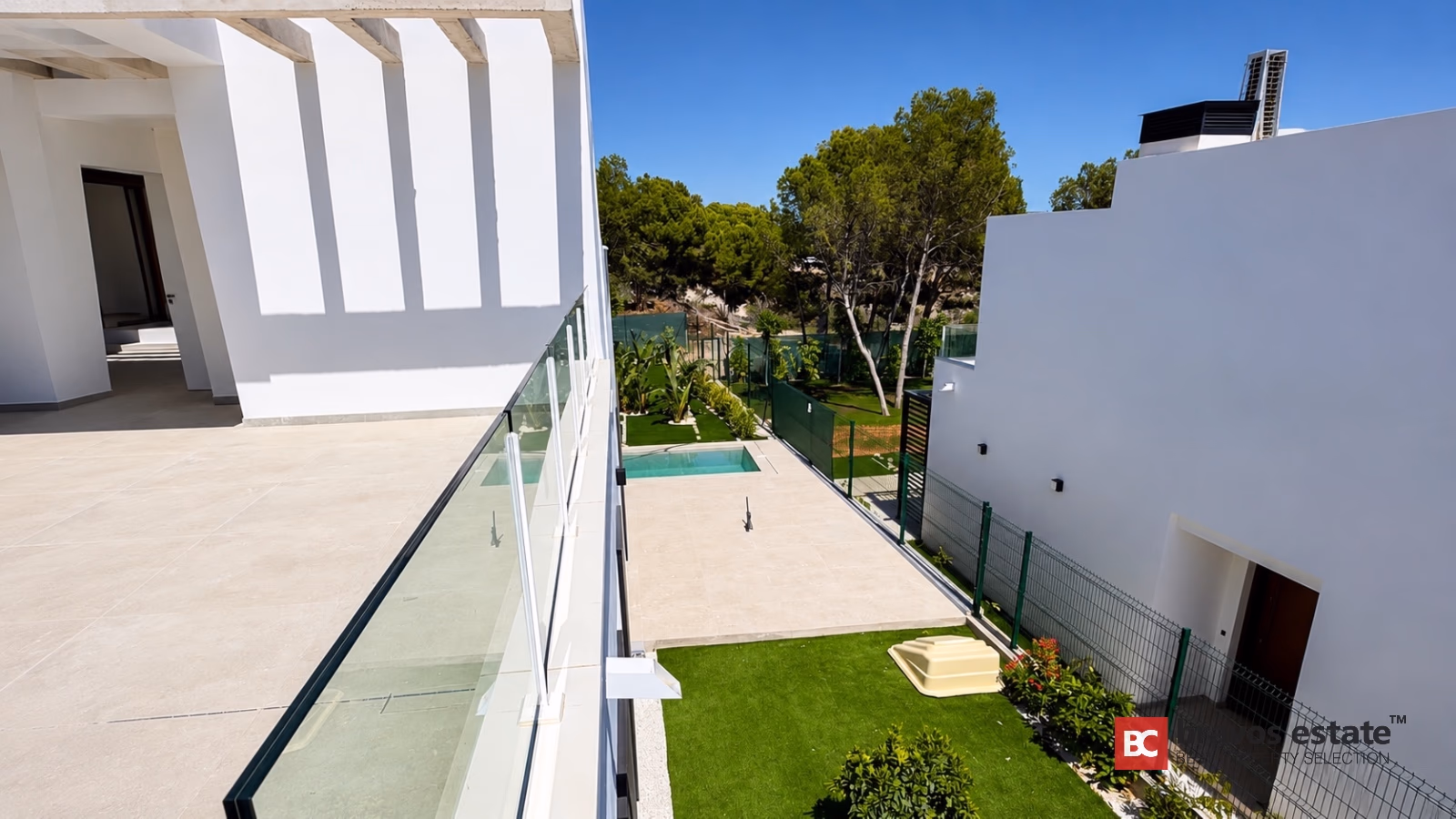 Modern villa terrace with pool and garden view in Finestrat