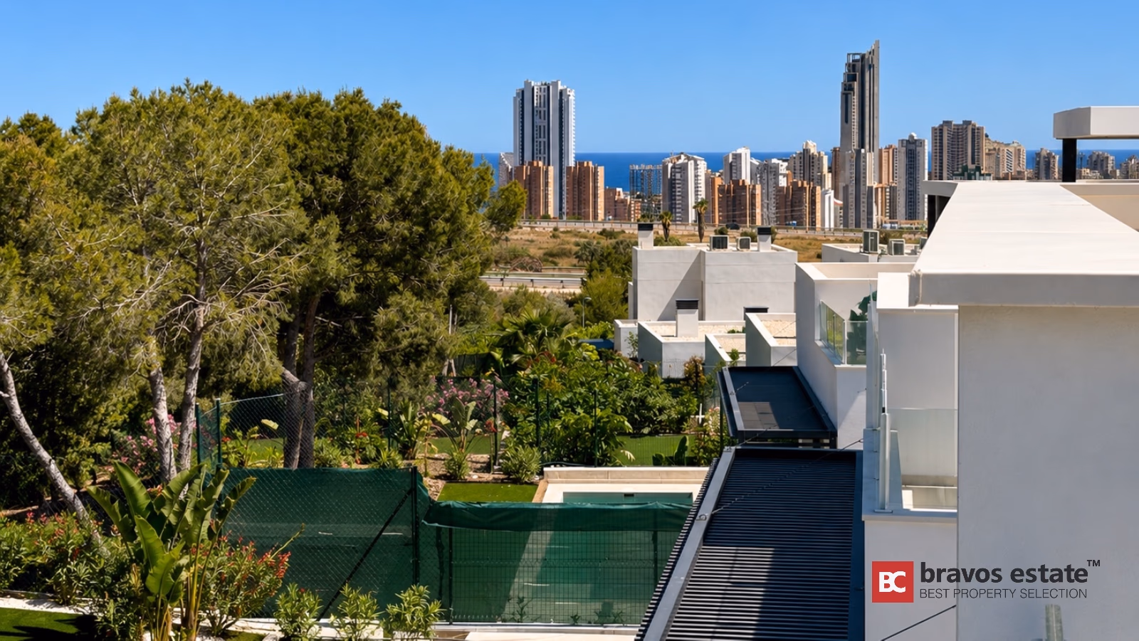 Modern villa exterior view with Benidorm skyline and sea views in Finestrat