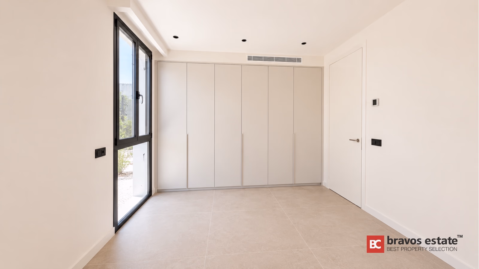Modern bedroom with built-in wardrobes and terrace access in Finestrat villa