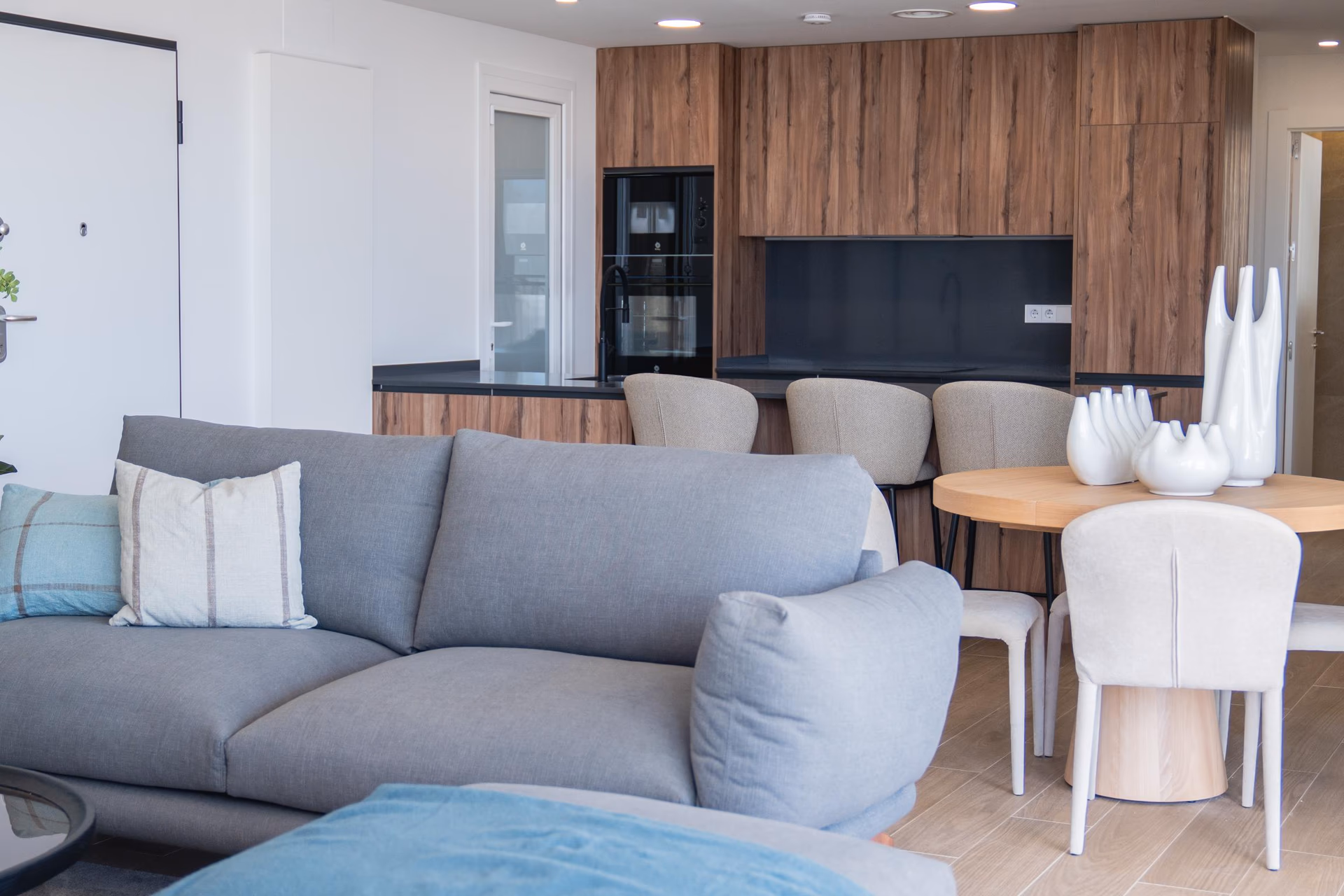 Living-dining area of the show villa with full-height glazing