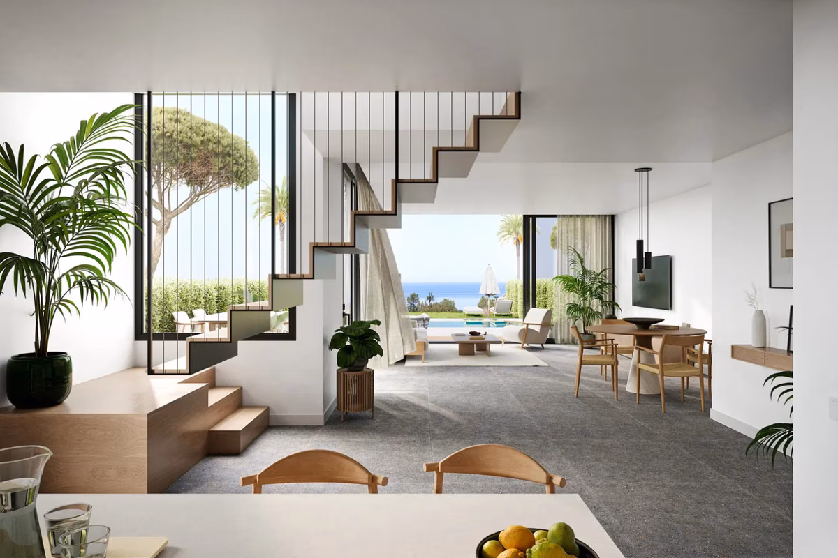 Гостиная-столовая открытой планировки с лестницей в Pine Valley Villas