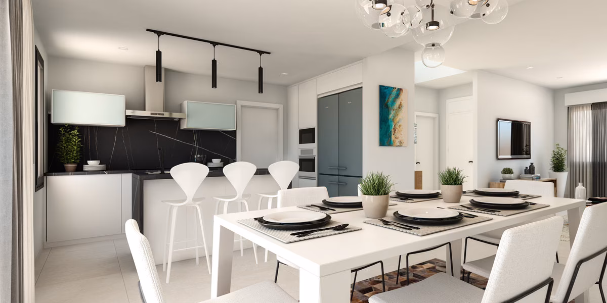 Кухня с белым обеденным столом, тёмным фартуком и подвесными светильниками